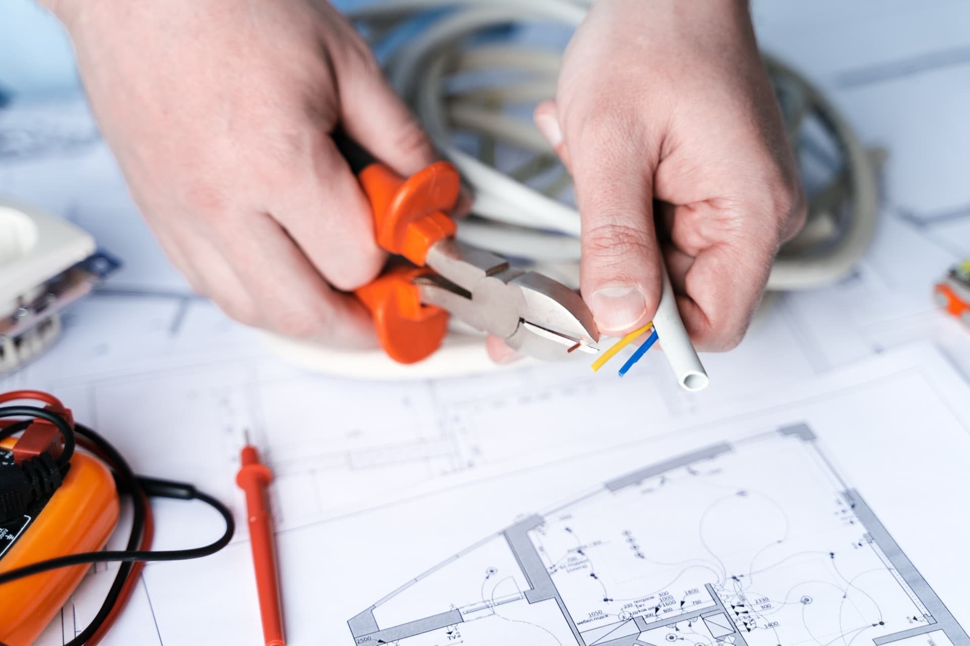 Tulio de Souza, owner of Prime Electrical, reviewing wiring plans
