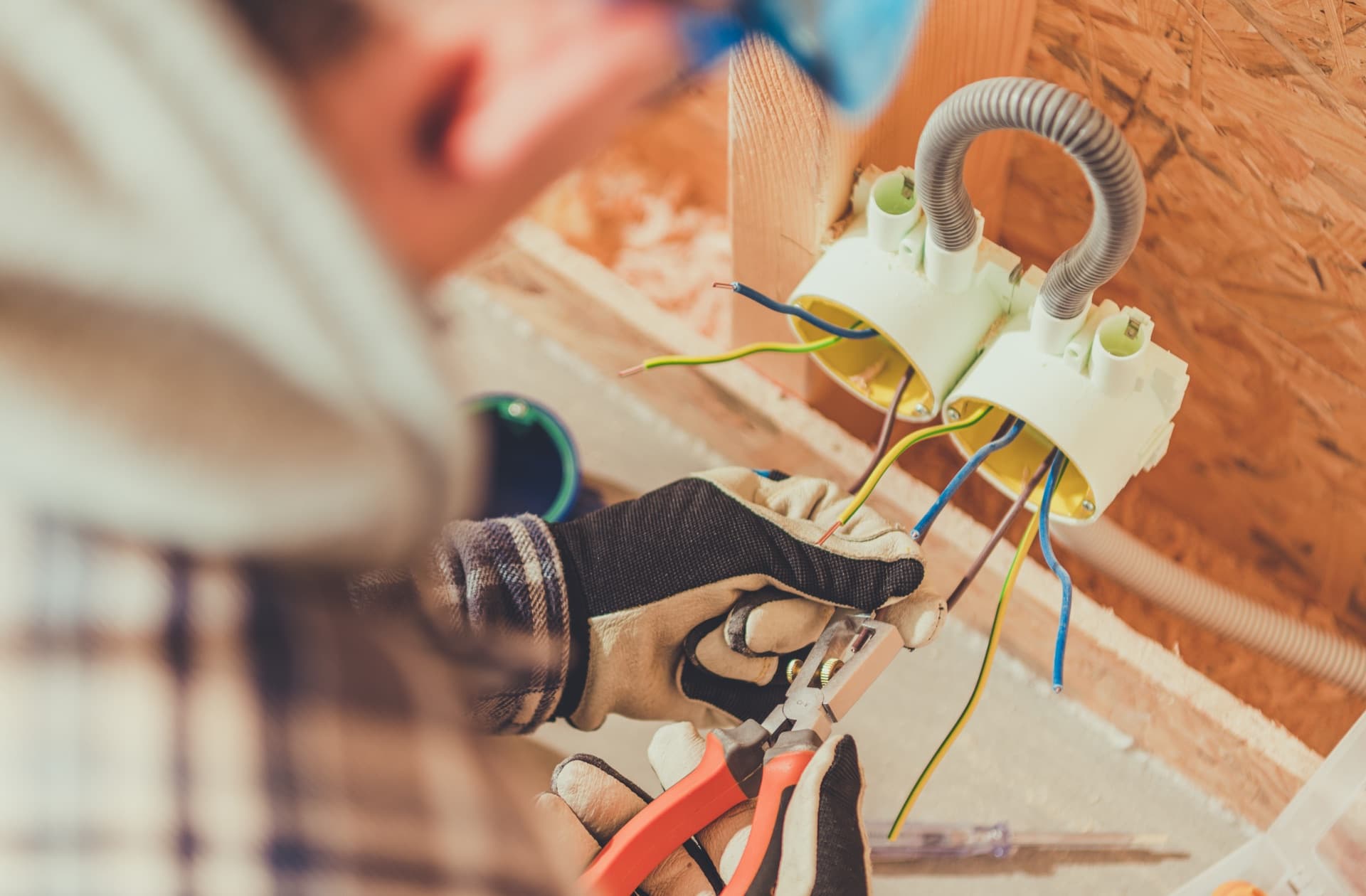 Residential electrician finishing a home wiring installation